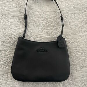 NWOT (never used)Coach Black Shoulder Bag with Matte Finish and Adjustable Strap